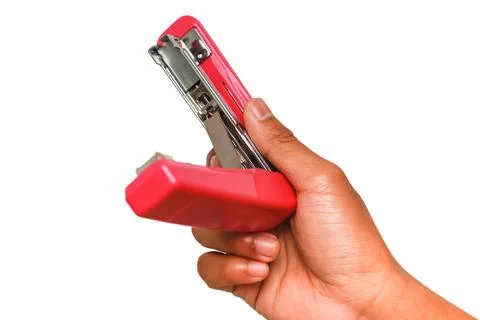Hand Holding a Red Stapler Ready to Use for Paper Fastening Task in Office Stock Photos