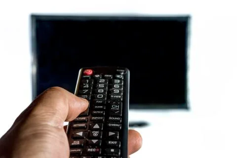 Hand holding a remote contro Stock Photos