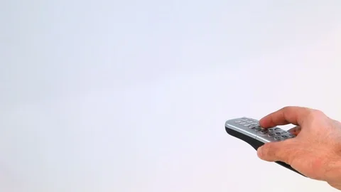 Hand Holding Remote Control And Changing Channels in White Background 库存影片 118236114