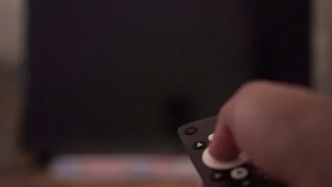 Hand holding remote control, changing TV channel. Smart TV streaming concept Stock Footage 342635751