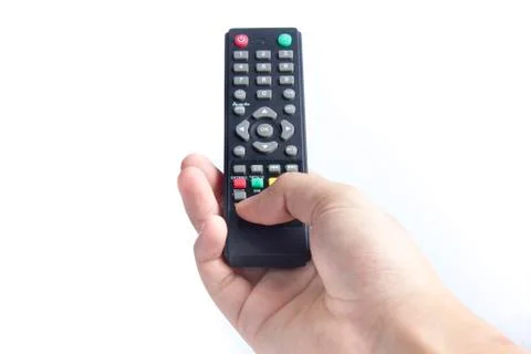 A hand holding a remote control Stock Photos