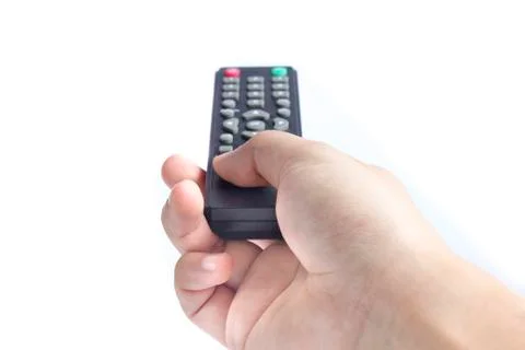 A hand holding a remote control Stock Photos