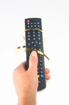 Hand holding a remote control Stock Photos