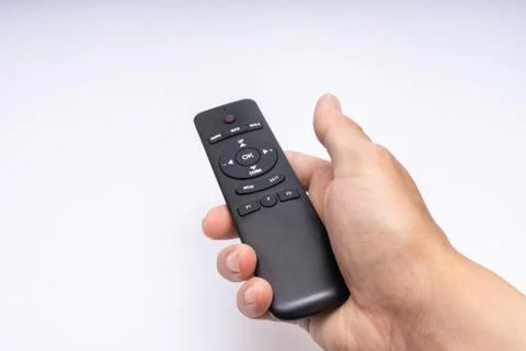  Hand holding a remote control Stock Photos