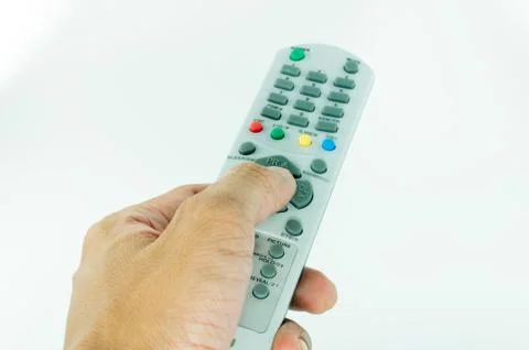 Hand holding remote control on white background Stock Photos