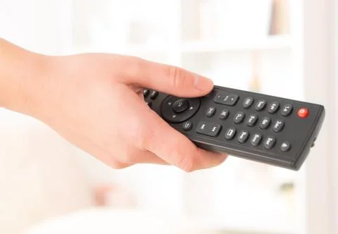 Hand holding remote controller Stock Photos