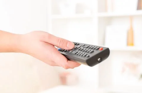 Hand holding remote controller Stock Photos
