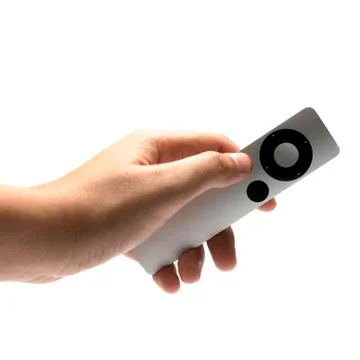 Hand holding remote Stock Photos