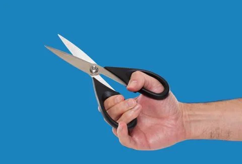 Hand holding scissors Stock Photos