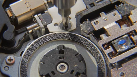 A hand holding a screwdriver is installing or repairing computer components. Stock Footage 95529401