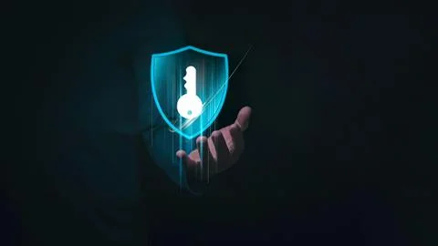 Hand holding shield with key symbol for security Stock Photos