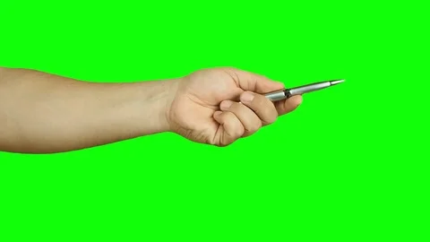 Hand holding silver ballpoint indicating isolated green screen Stock Footage
