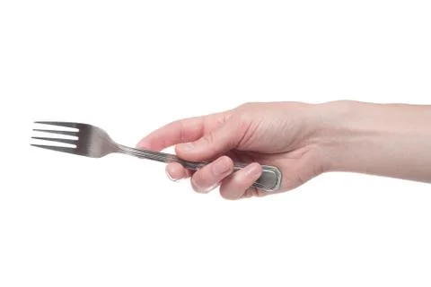 Hand holding a silver fork on an isolated white background Foto stock