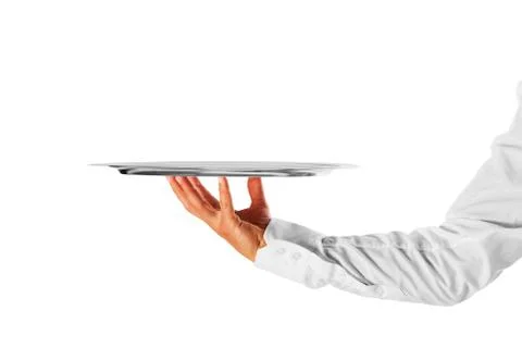 A hand holding a silver tray Stock Photos