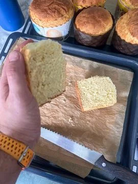 Hand Holding Slice of Homemade Easter Panettone Bread Stock Photos