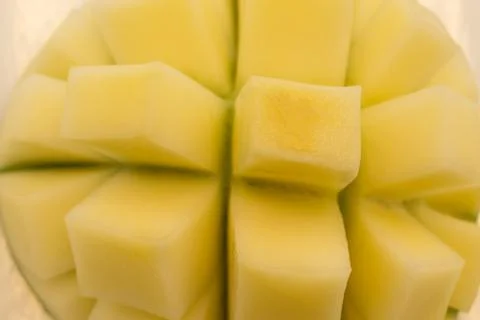 Hand holding slice mango isolated on white background. Stock Photos
