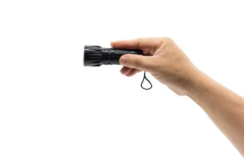 Hand holding a small black flashlight Stock Photos