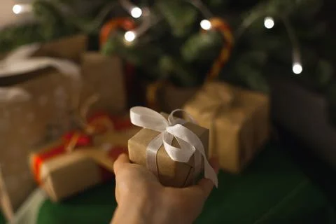 Hand holding a small gift box Stock Photos