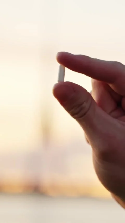 Hand Holding Small White Pill Sample Vial Stock Footage 327274118