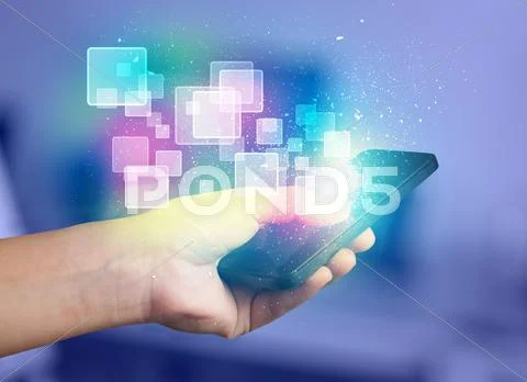 Hand holding smart phone with abstract glowing squares Stock Photos