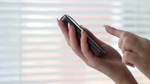Hand holding smart phone Stock Footage 1087457
