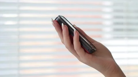 Hand holding smart phone Stock Footage 1087462