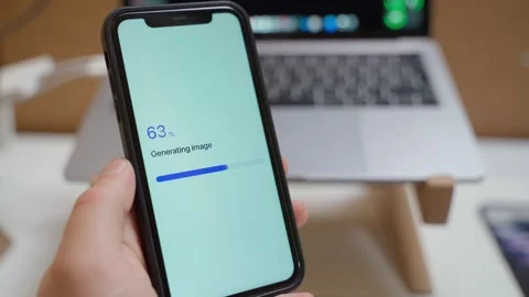 Hand holding smartphone with AI image generation progress completing. Image Stock Footage 342911124