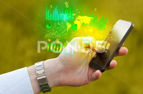 Hand holding smartphone with business diagrams Stock Photos