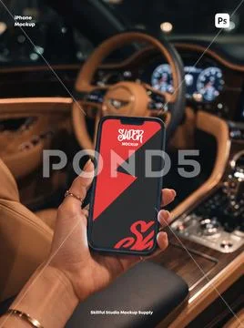 Hand holding smartphone in car PSD Template