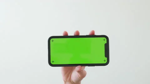 Hand holding smartphone with chroma key screen. 스톡 동영상 146828078