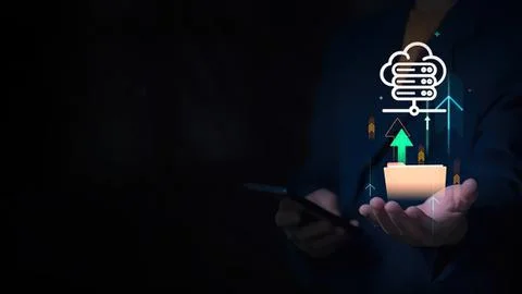 Hand holding smartphone with cloud data and arrow icons Stock Photos