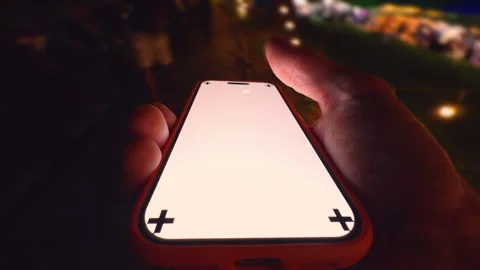 Hand Holding Smartphone with Corner Tracking Marks While Rapidly Walking Down a Stock Footage 320733623
