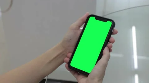 Hand holding smartphone Stock Footage 219531171