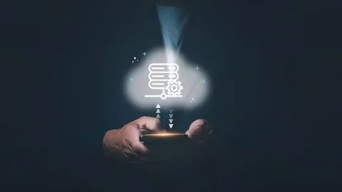 Hand holding smartphone with glowing data icon and steam Stock Photos