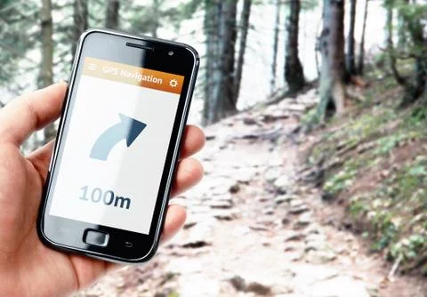Hand holding smartphone with gps navigation on the screen Stock Photos