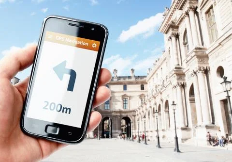 Hand holding smartphone with gps navigation on the screen Stock Photos