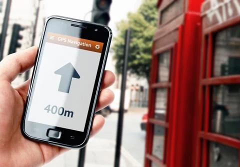 Hand holding smartphone with gps navigation on the screen Stock Photos