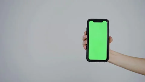 Hand Holding Smartphone with Green Screen - 4K Video Stock Footage 340045018