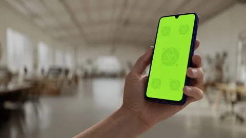 A hand holding a smartphone in a large Stock Footage 294820723