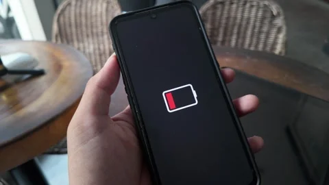 Hand Holding Smartphone With Low Battery Red Level Icon Vertical Stock Video Stock Footage 341396080