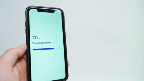Hand holding smartphone with payment app progress bar stuck at 70 percent while Vídeo Stock 342811085