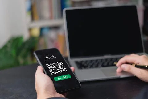 Hand holding smartphone with QR code on screen, ready to scan. Perfect for .. Foto stock