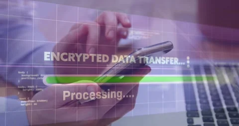 Hand holding smartphone showing encrypted transfer overlay on laptop keyboard Stock Footage 328928379