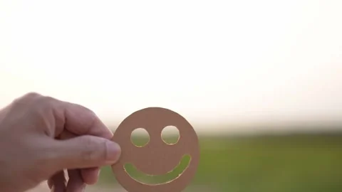 Hand Holding Smiley Face Cutout Outdoors Stock Footage 292477944