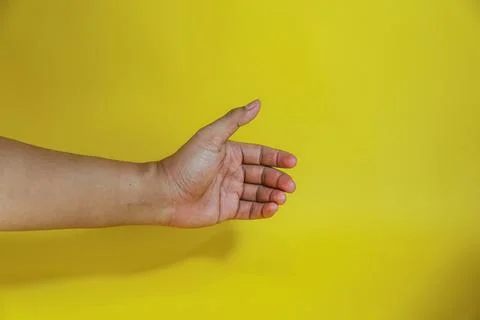 Hand holding something like a bottle Stock Photos