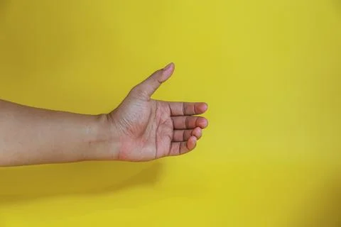 Hand holding something like a bottle Stock Photos