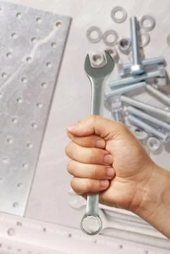 Hand holding spanner Stock Photos