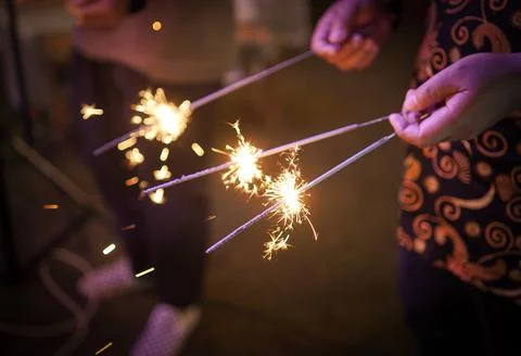Hand holding sparkler Stock Photos
