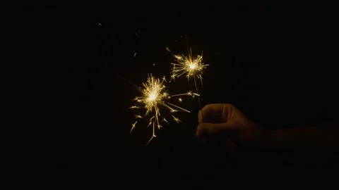 Hand Holding Sparklers Closeup Stock Footage 230294975
