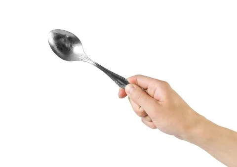 Hand holding spoon. Close up. Isolated on white background Stock Photos